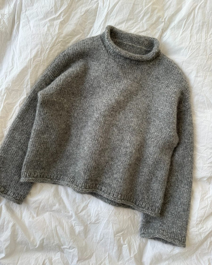 Liggende grå Cloud Sweater