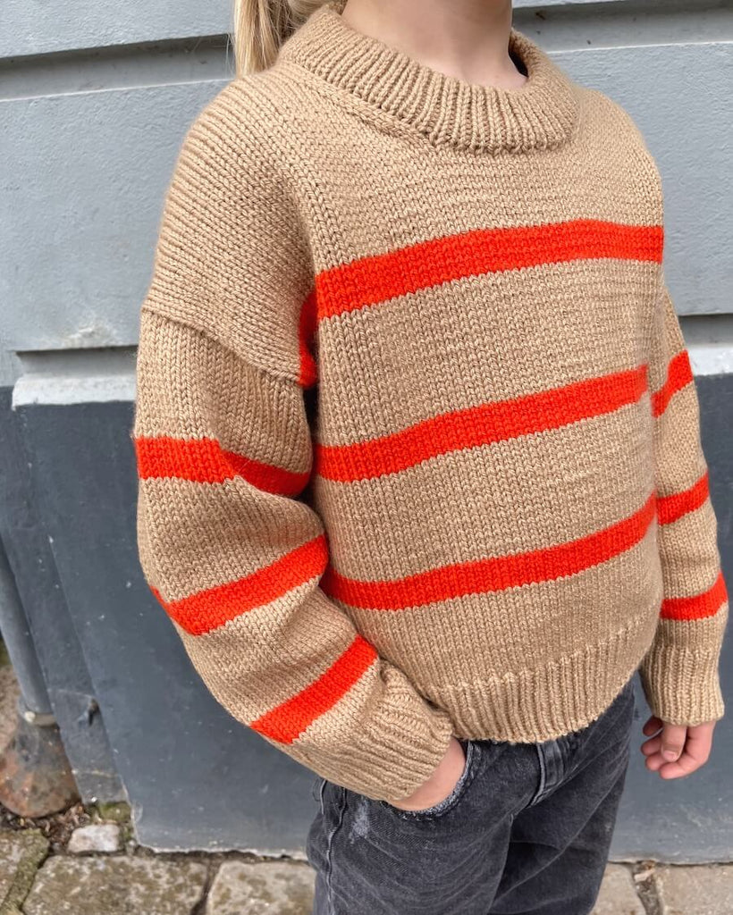 Barn iført brun og orange Marseille Sweater Junior