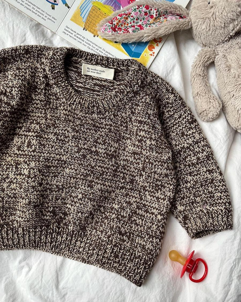 Liggebillede af brun og hvid Melange Sweater Baby