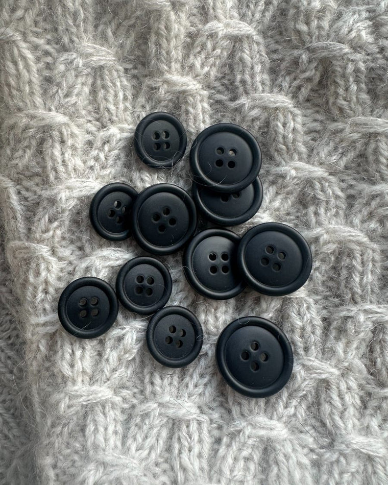 Én sort galalit knap Ø 23 mm