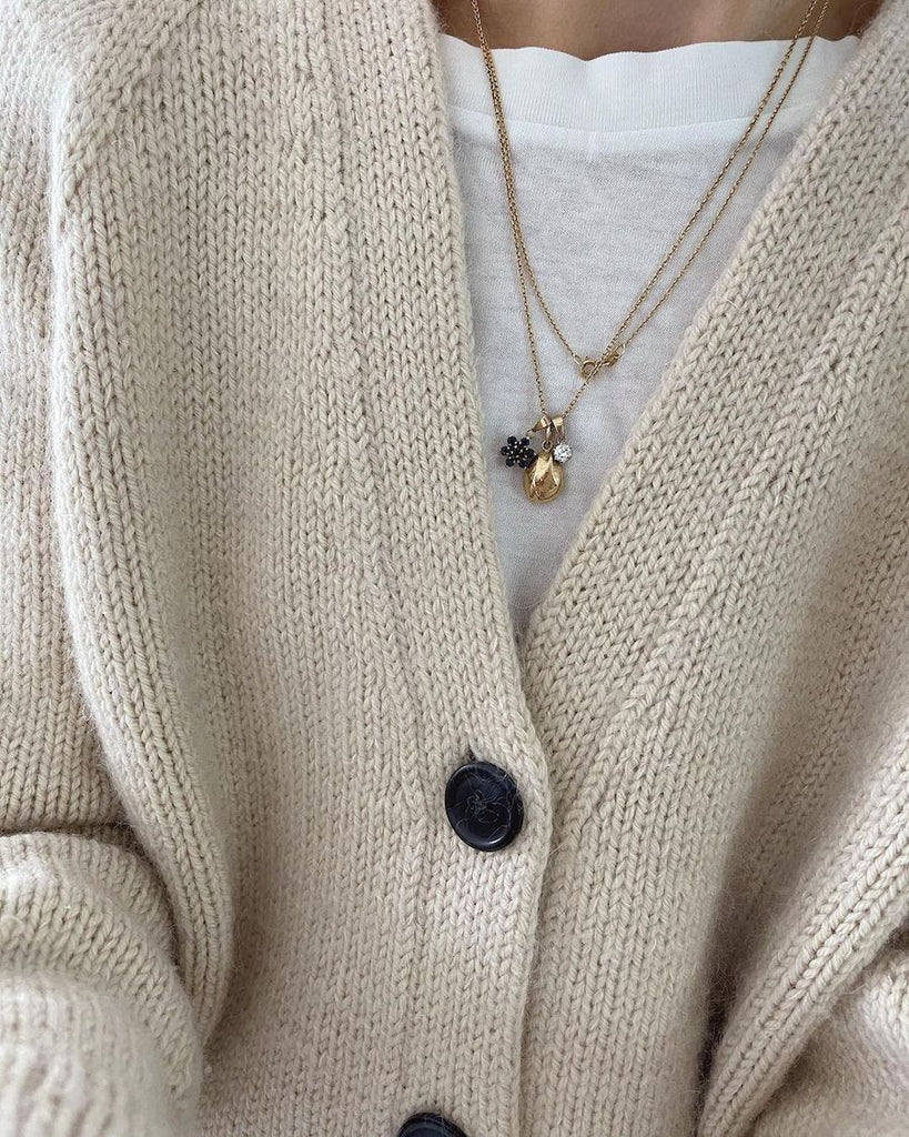 Closeup af hvid Champagne Cardigan