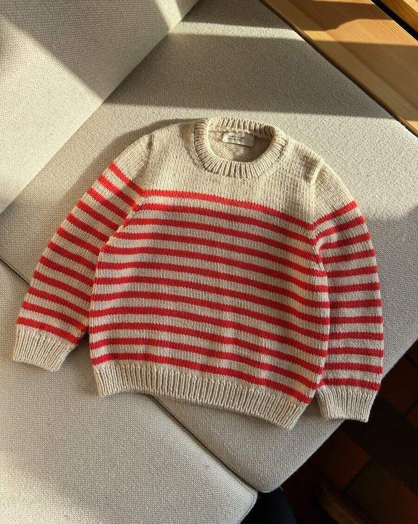 Liggebillede hvid og rød Lyon Sweater Junior 
