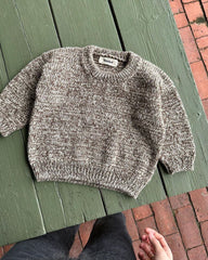 Liggebillede af lysebrun og hvid Melange Sweater Baby